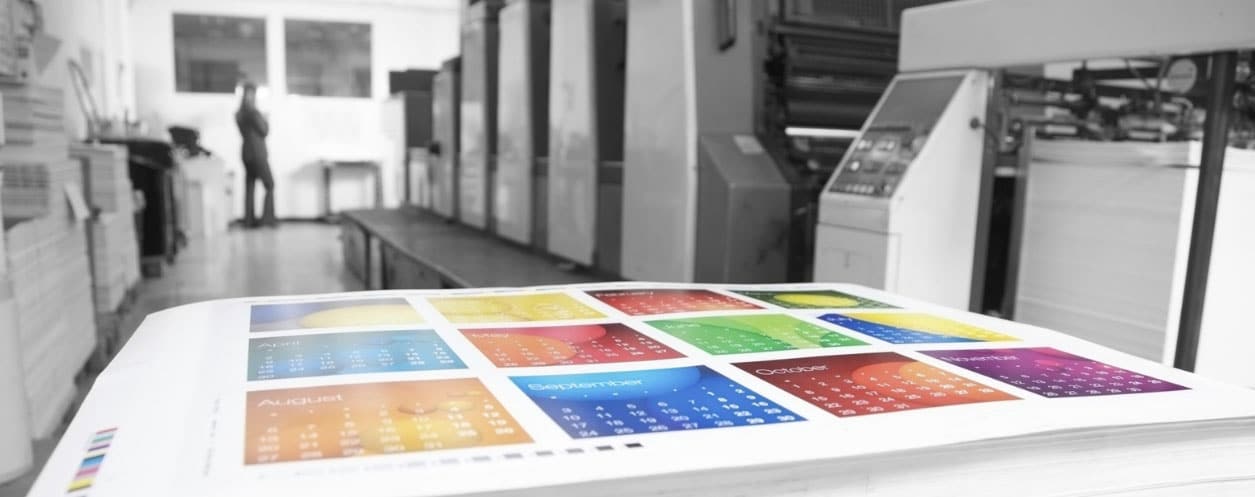 What is the difference between wholesale and retail orders in the printing industry?